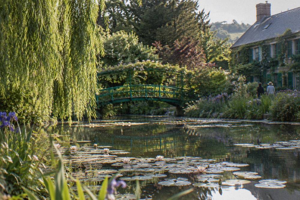 Water lily pond with Japanese bridge in Monet's garden at Giverny